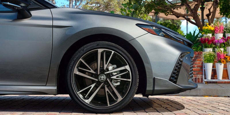 A close look at the a silver camry.