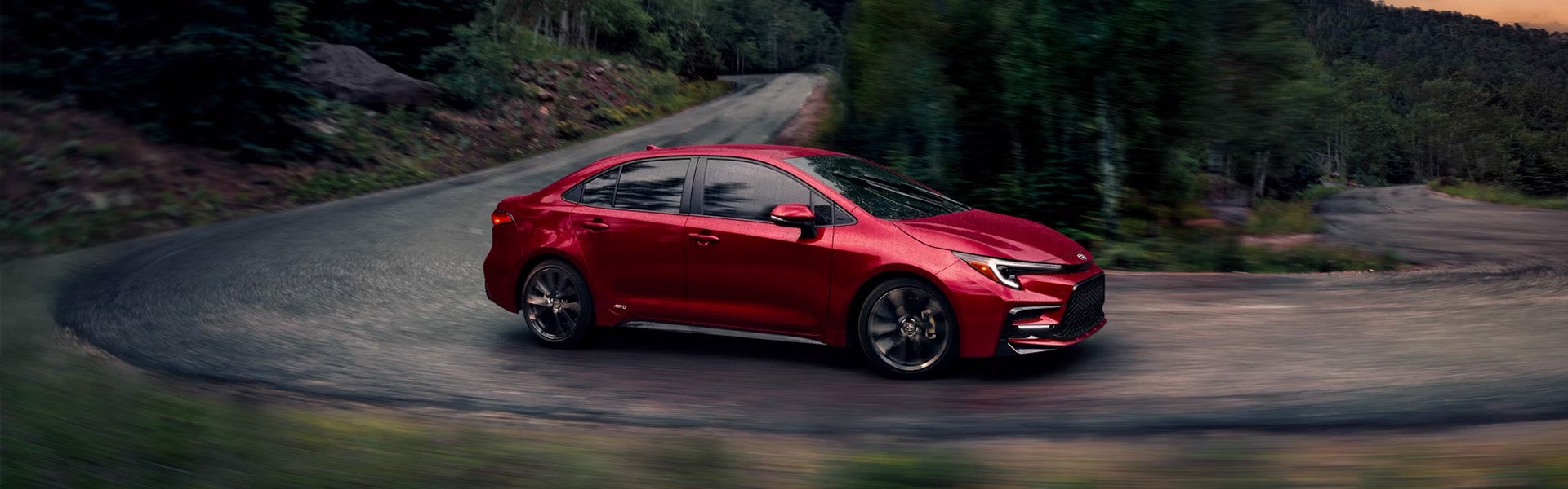 A white car driving on the road.