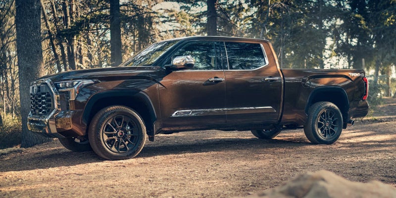 A brown truck sitting parked.