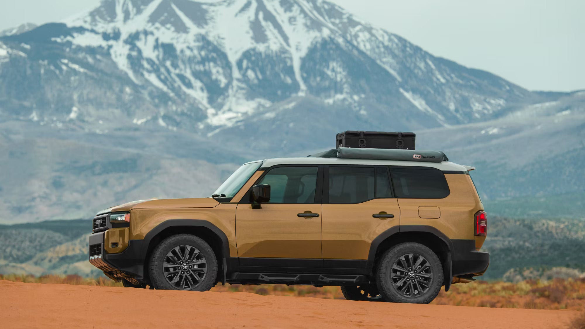 A brown suv parked off-road.
