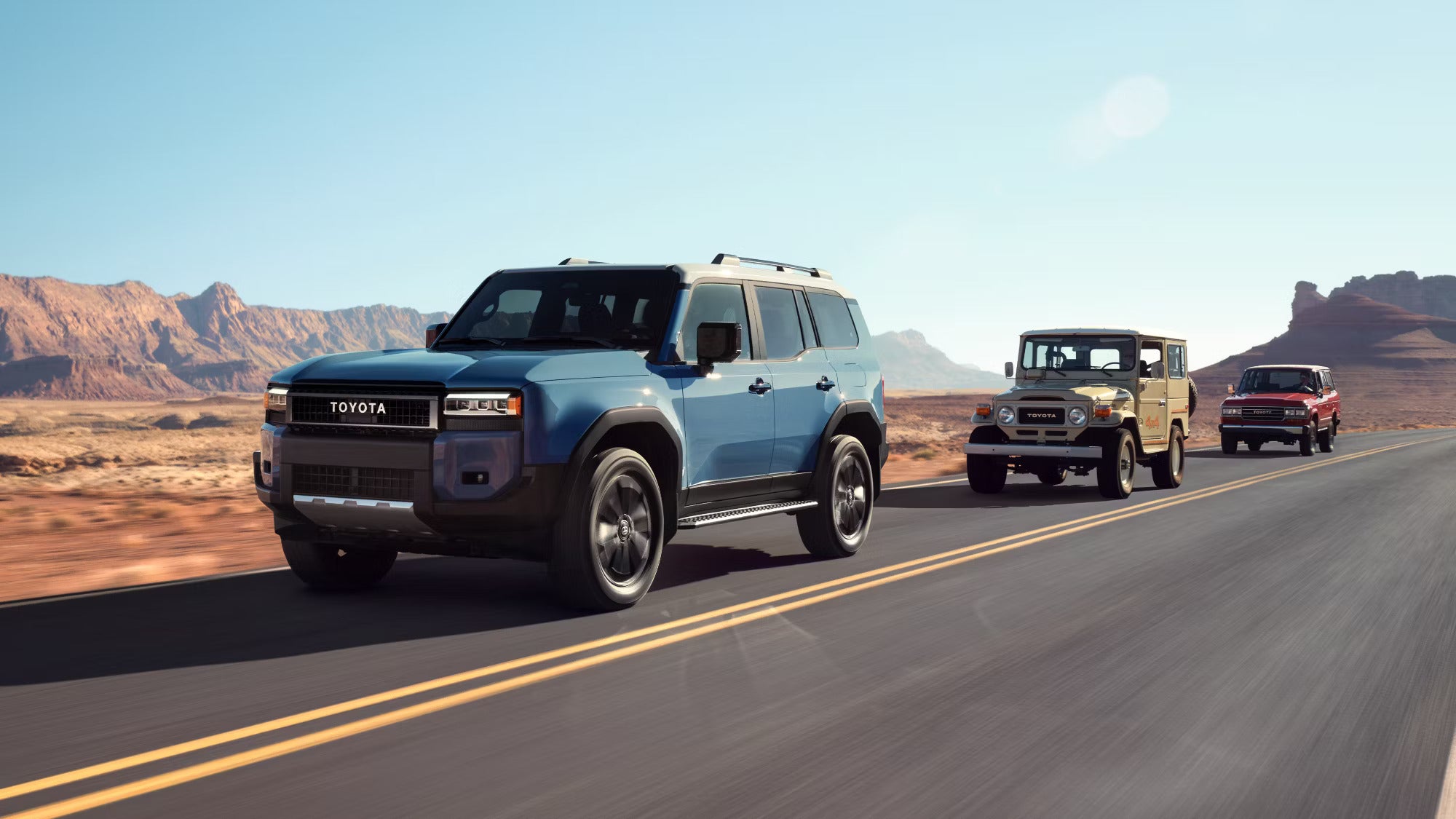 Three cars driving dwon a road.