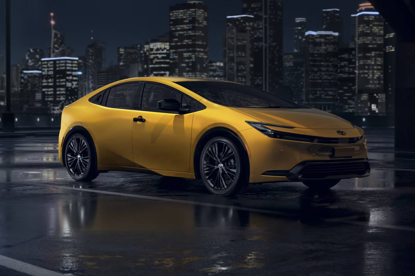 A yellow car sitting on the road.